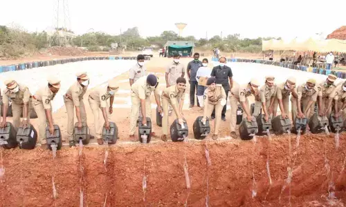 Rajamahendravaram Urban Superintendent of Police Aishwarya Rastogi and Special Enforcement Bureau Joint Director A Ramadevi destroying ID liquor in Rajamahendravaram on Tuesday