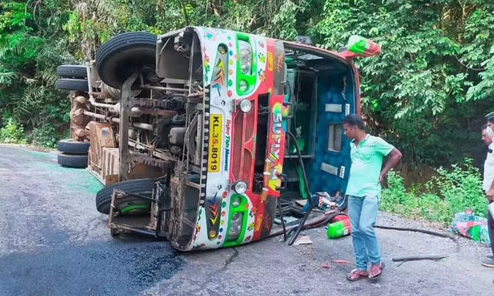 The bus that toppled after the accident in Kollur on Tuesday