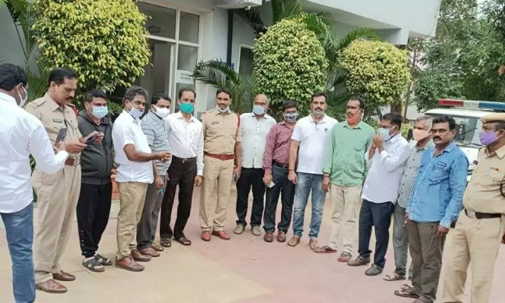 Police with the detained teachers in Karimnagar on Wednesday