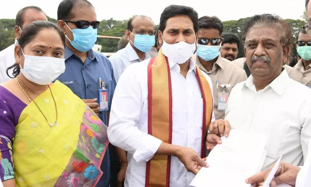 MLC KS Lakshmana Rao submitting a memorandum to Chief Minister YS Jagan Mohan Reddy in Guntur on Wednesday