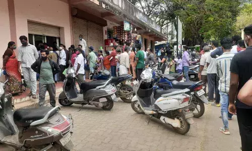 People standing before the Covid testing centre at Ruia Hospital in Tirupati on Monday