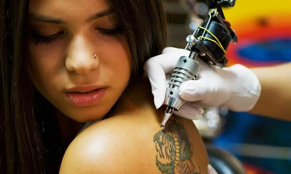 Focus while getting inked