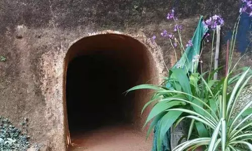 The entrance of the tunnel that C.T. Thomas dug through a hill in Kannur district, Kerala.