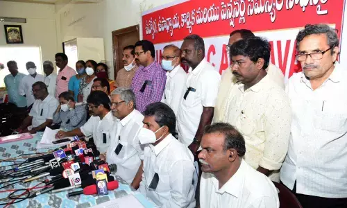AP NGOs president Bandi Srinivasa Rao, AP JAC Amaravati chairman Bopparaju Venkateswarlu and  other leaders at a press conference in Vijayawada on Tuesday