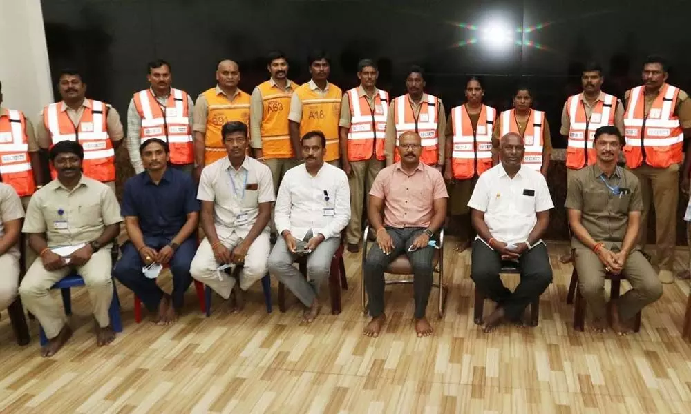 Chief Vigilance and Security Officer Gopinath Jatti with the staff who won merit awards at Tirumala on Wednesday