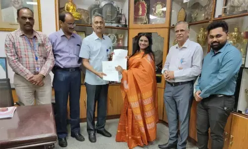 PB Siddhartha College of Arts and Science exchanging MoU papers with Hyderabad IT firm Blackbuck Engineers in the college in Vijayawada on Wednesday