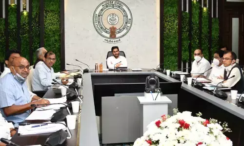 Chief Minister YS Jagan Mohan Reddy reviews YSR digital libraries project at his camp office in Tadepalli on Wednesday