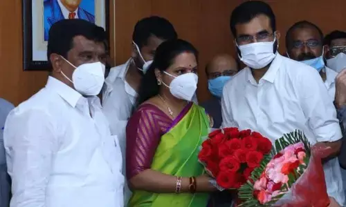 Nizamabad District DCCB Chairman Pocharam Bhaskar Reddy congratulating MLC K Kavithaka at Legislative Council in Hyderabad on Wednesday