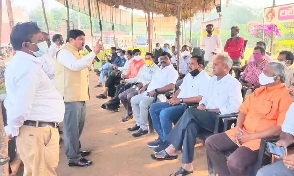 AITUC national working committee member C Sreekumar speaking at the relay hunger strike camp in Visakhapatnam on Thursday