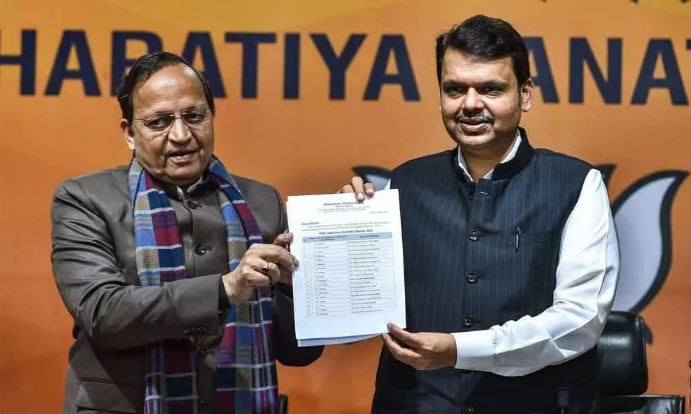 BJP leader Arun Singh and BJP Goa election in-charge Devendra Fadnavis announce the list of party candidates for Goa assembly polls in New Delhi on Thursday
