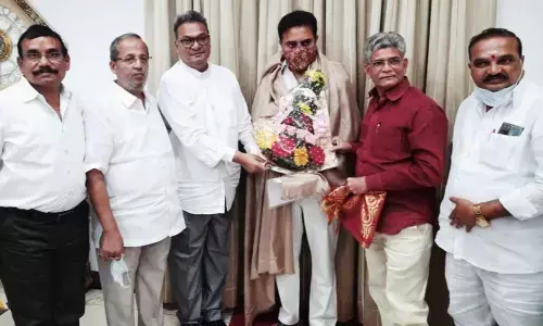 Prakash Ammanabolu, president, Telangana State Federation of Textile Associations, greeting Minister K T Rama Rao, along with Karnati Surander, Santhosh Chokhani, Ganduri Shanker, vice-president, Chakrapani Jindam, in Hyderabad.