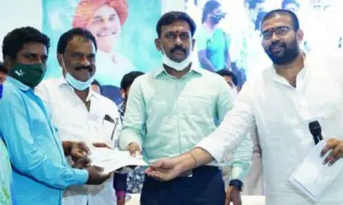 YSRCP MLA Jakkampudi Raja provides accidental insurance to Village volunteers in Rajanagaram
