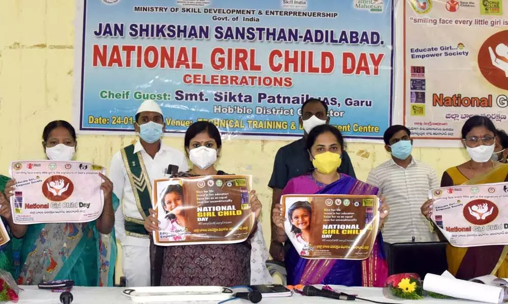 Collector Sikta Patnaik and other officials releasing a poster Girl’s Day in Adilabad on Monday