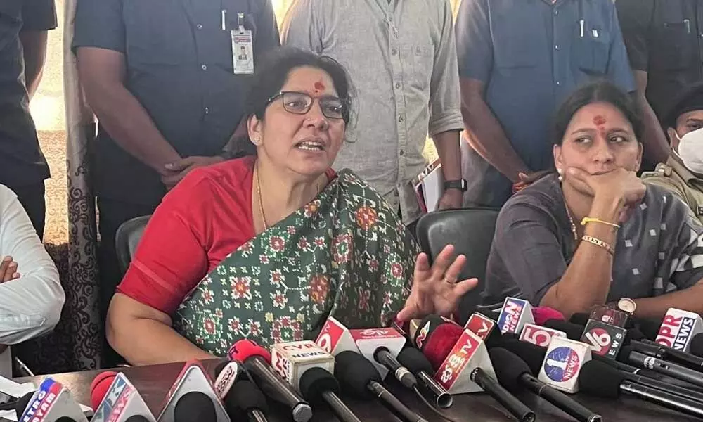 Minister for Tribal Welfare Satyavathi Rathod speaking to media persons at Medaram in Mulugu district on Monday. Mahabubabad MP Maloth Kavitha is also seen