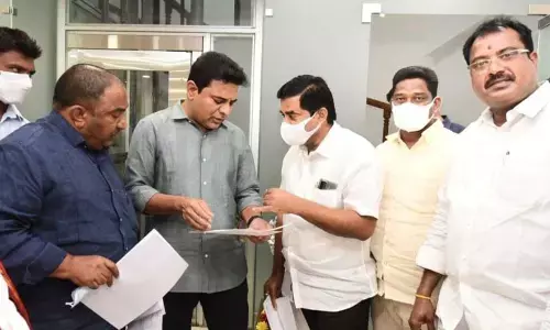 Sathupalli MLA Sandra Venkata Veeraiah discussing development works of Sathupalli with Minister KTR in Hyderabad on Monday