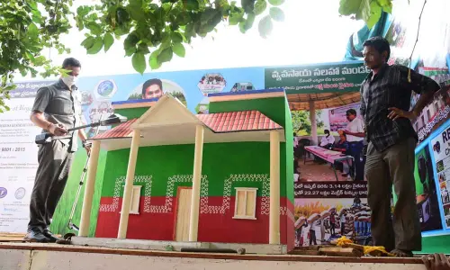 Police personnel checking the arrangements for Republic Day celebrations at Indira Gandhi Municipal Corporation stadium in Vijayawada on Monday