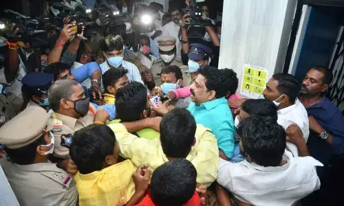 Police arresting former MLC Buddha Venkanna in One Town in Vijayawada  on Monday  (Photo:  Ch Venkata Mastan)