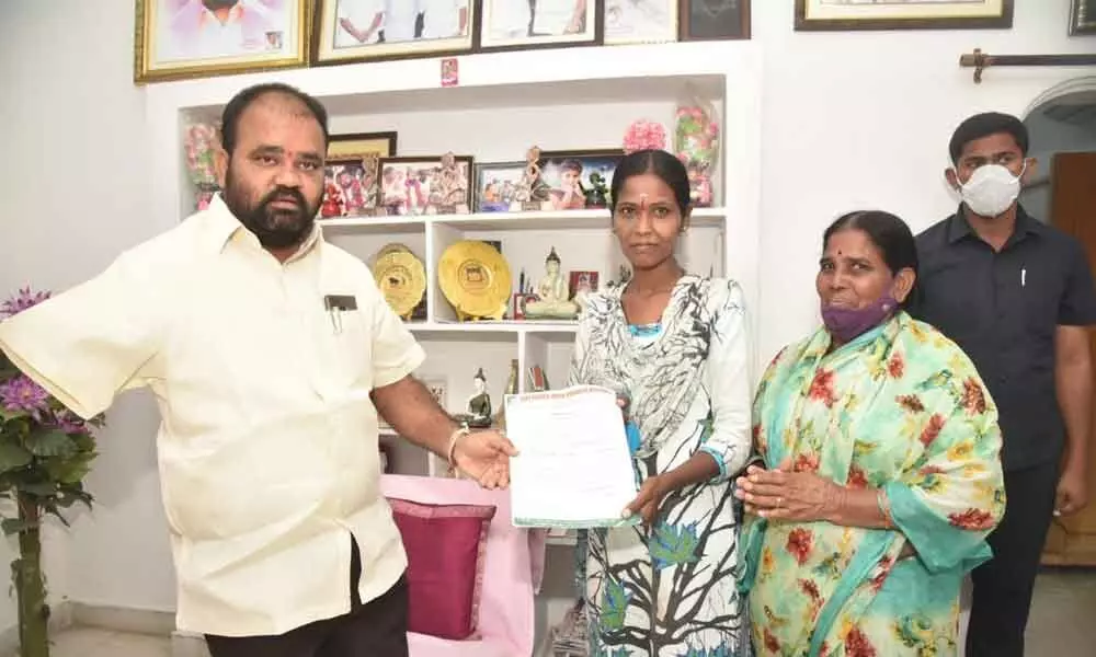 MLA Bhupal Reddy handing over letter of appointment to Karishma at his camp office in Nalgonda on Tuesday