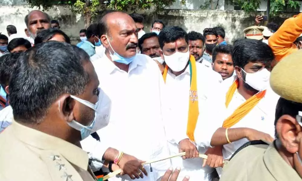 The police and BJP leaders having heated exchange during the protest at the government hospital in Khammam on Tuesday