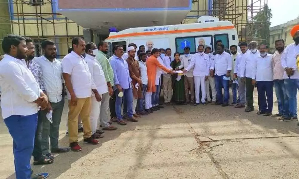 BJP leader T Srinivas Goud handing over the ambulance to the Superintendent of the government hospital in Karimnagar on Tuesday