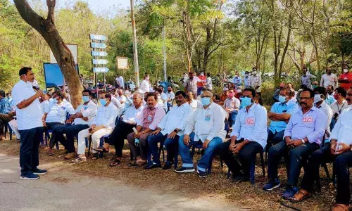 VSP recognised union president J Ayodhya Ram speaking at the dharna in Visakhapatnam on Tuesday