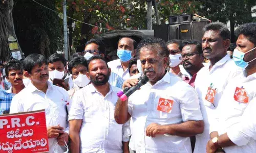 MLC KS Lakshmana Rao addressing the gathering at the Collectorate in Guntur city on Tuesday