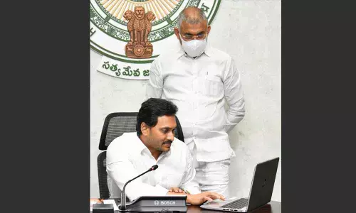Chief Minister Y S Jagan Mohan Reddy releases the amount under EBC Nestham into the accounts of women beneficiaries, at his camp office in Tadepalli on Tuesday