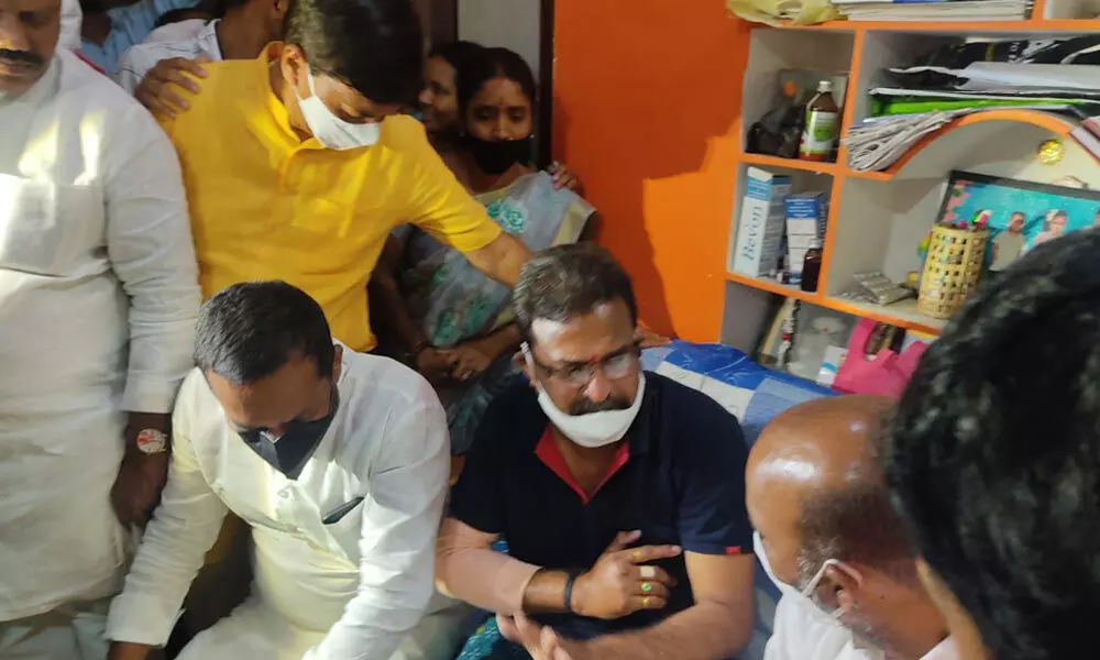 BJP State president Bandi Sanjay consoling BJYM district secretary Amandu Vijay Krishna injured in an attack by turmeric farmers, in Nizamabad on Thursday