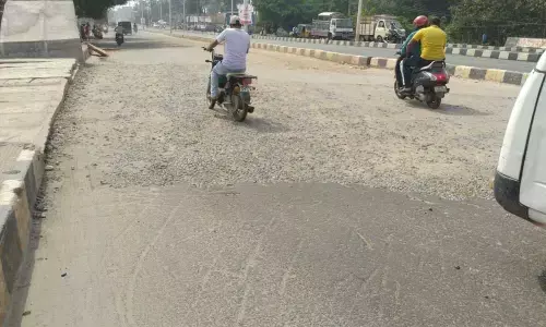 An uneven gravel path that stretch along BRTS road