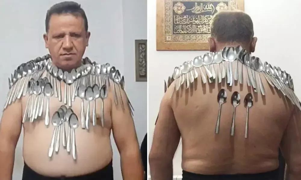 Man From Iran Holds New Guinness World Record For Balancing 85 Spoons On His Body
