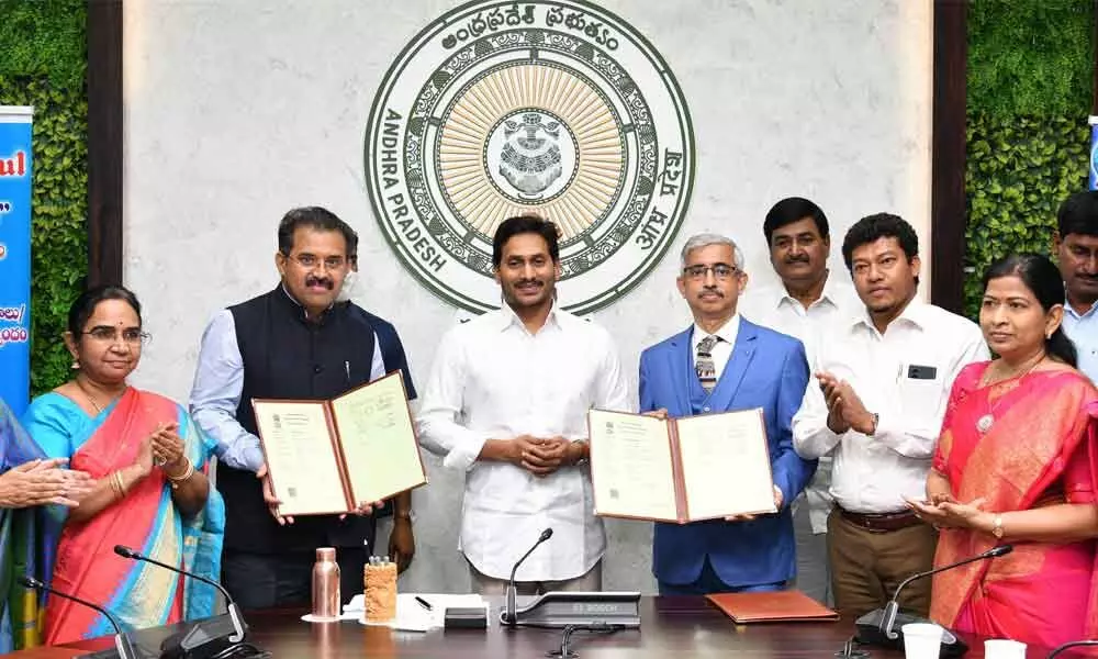 AP Dairy Development Cooperative Federation  (APDDCF) MD Babu A and Amul senior GM J Rajan exchanging an MoU in the presence of Chief Minister Y S Jagan Mohan Reddy at his camp office in Tadepalli on Friday. Deputy Chief Minister Dharmana Krishna Das, Ministers S Appalaraju, T Vanitha and  Special Chief Secretary (Agriculture) Poonam Malakondaiah are also seen.