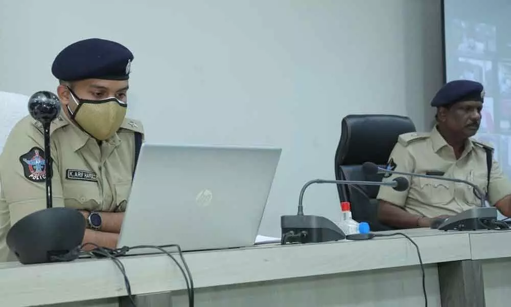Guntur Urban SP K Arif Hafeez conducting zoom conference with sector SIs from the DPO in Guntur city on Friday. Additional SP D Gangadharam is also seen