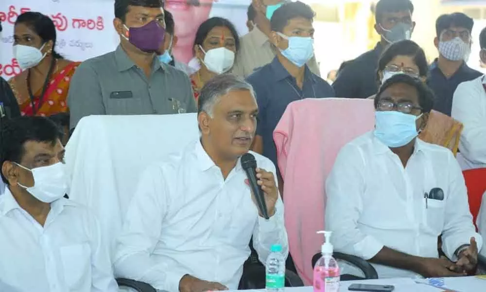 Minister for Health and Finance T Harish Rao and Transport Minister Puvvada Ajay Kumar conducting a review meeting after launching development works in Khammam on Friday