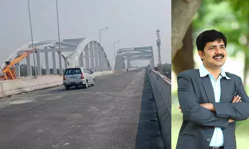 The vehicles going on one side of ROB near SV Veterinary College in Tirupati on Monday; MP Maddela Gurumoorthy