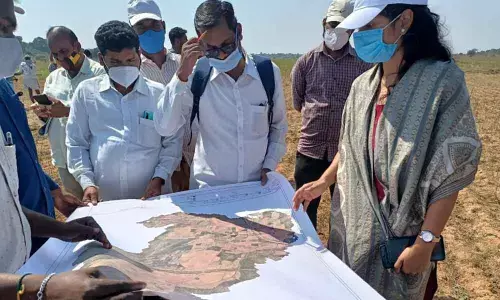 Nandyal Sub-Collector Chahat Bajpai inspecting YSR Jagananna Saswatha Bhu Hakku and re-surveying works at Bapuram village in Mahanandi mandal on Monday