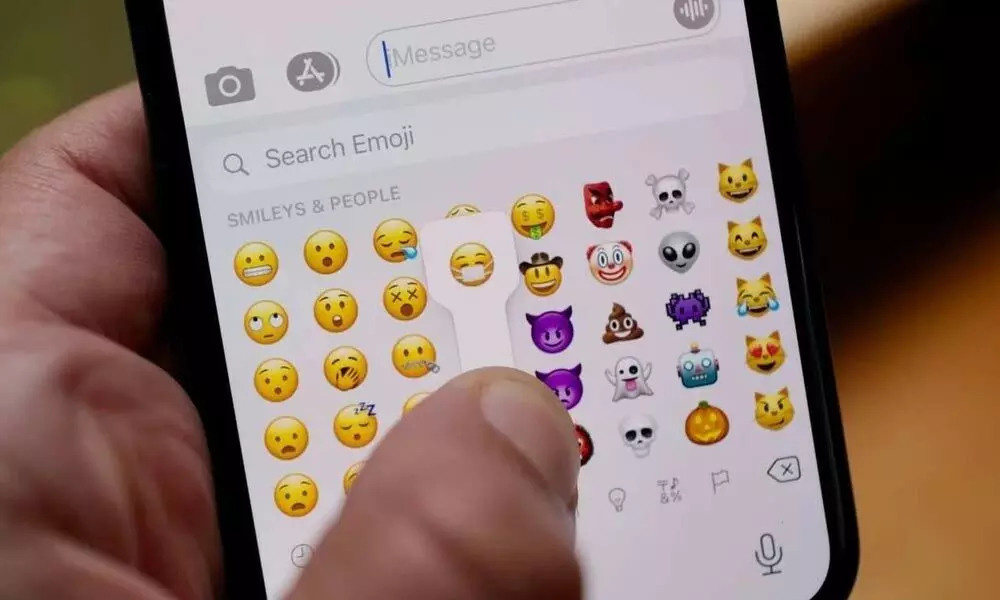 What new emojis are available on Apple's iOS 15.4?