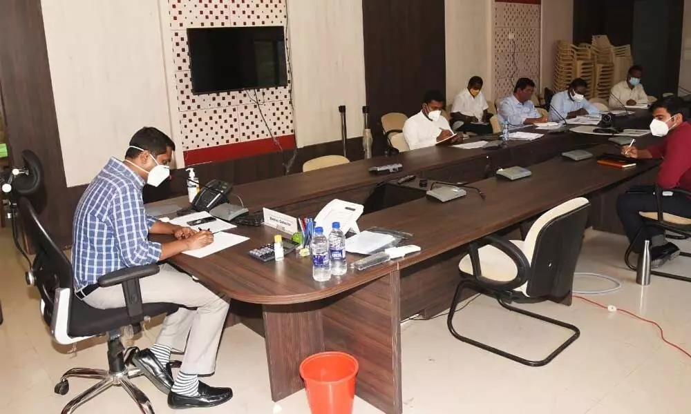 Collector M Harinarayanan holding a meeting with the officials of the Education Department at the Collectorate in Chittoor on Tuesday