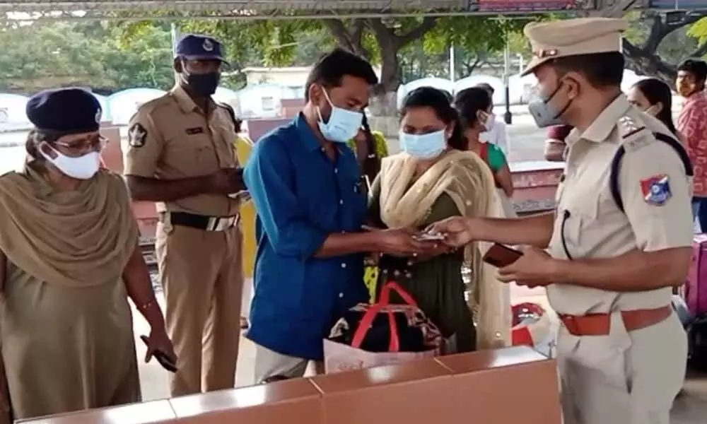 Railway police inspecting the identity of a couple at Chirala railway station on Thursday