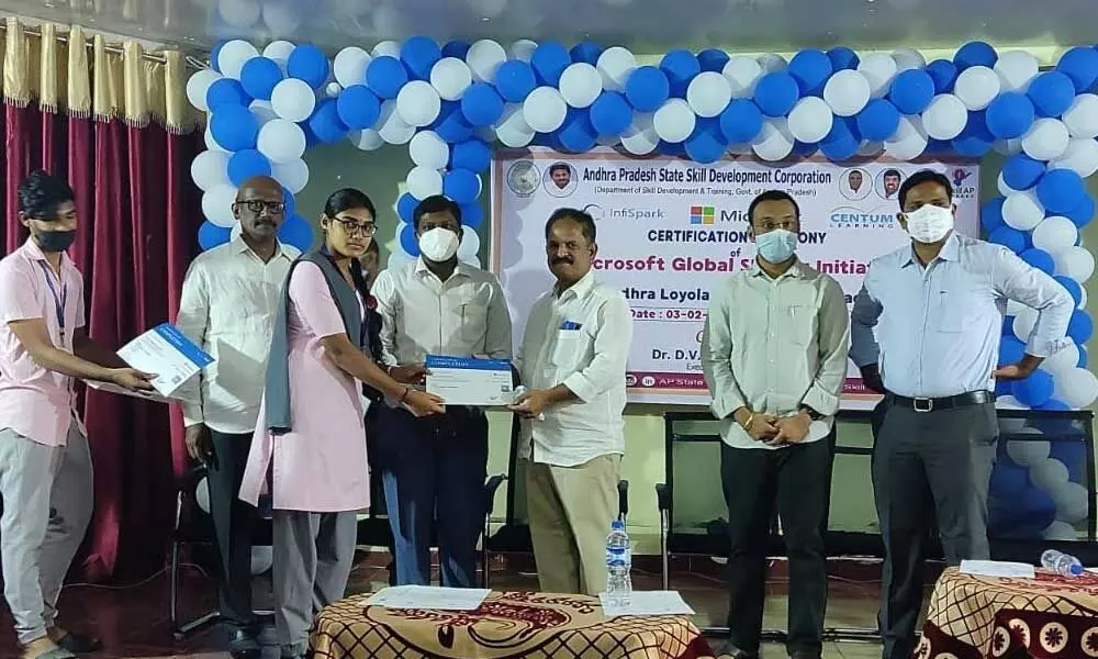 APSSDC Executive Director Dr DV Ramakoti Reddy presenting certificates to students at a programme at Andhra Loyola College in Vijayawada on Thursday
