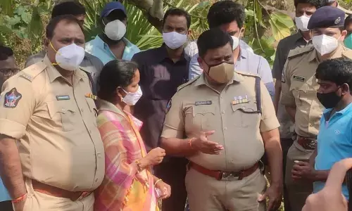 District Superintendent of Police M Ravindranath Babu interacting with the bereaved families of toddy tragedy at Lododdi village on Thursday