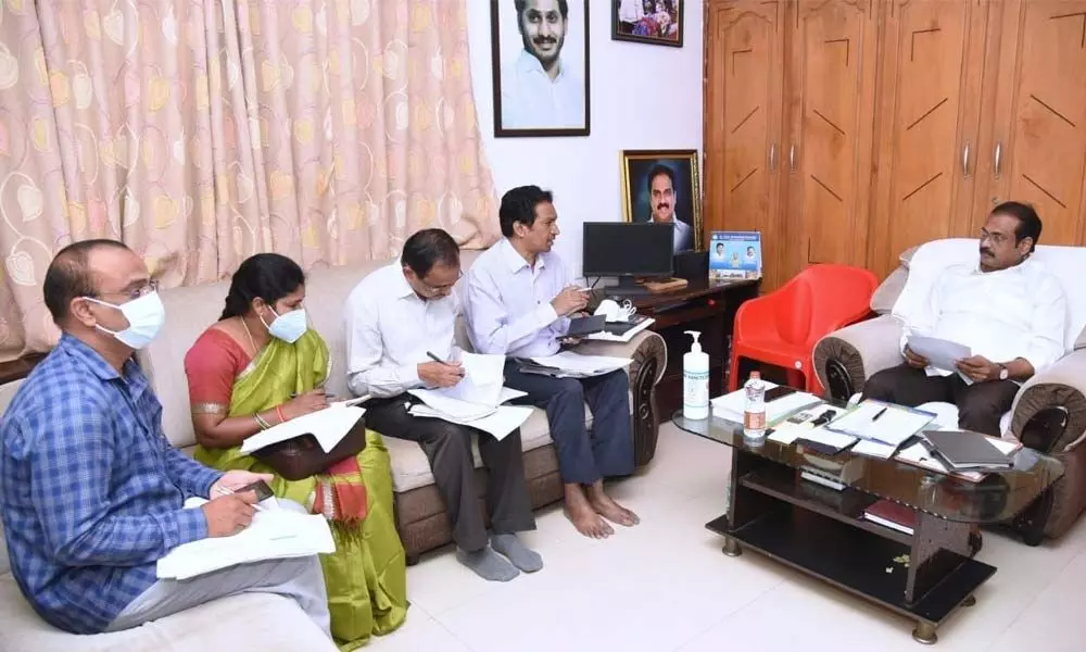 Agriculture Minister K Kannababu holding a review meeting with officials in Kakinada on Saturday