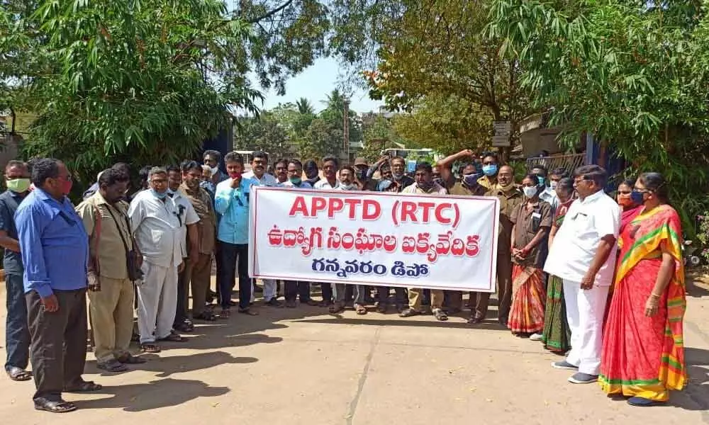 Public Transport Department employees staging a  protest at Gannavaram depot in Krishna district on Saturday