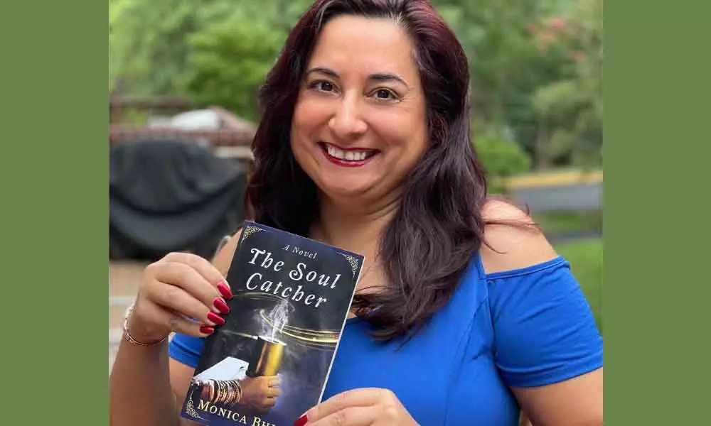 Monica Bhide with her book The Soul Catcher