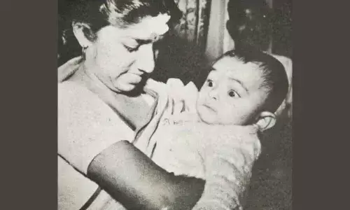 Lataji playing with little Rishi Kapoor