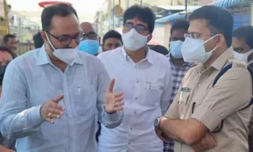 District collector Srikesh B Lathakar giving instructions to SP Amith Bardhar and temple EO during inspection of arragements at Sun God temple  on Monday