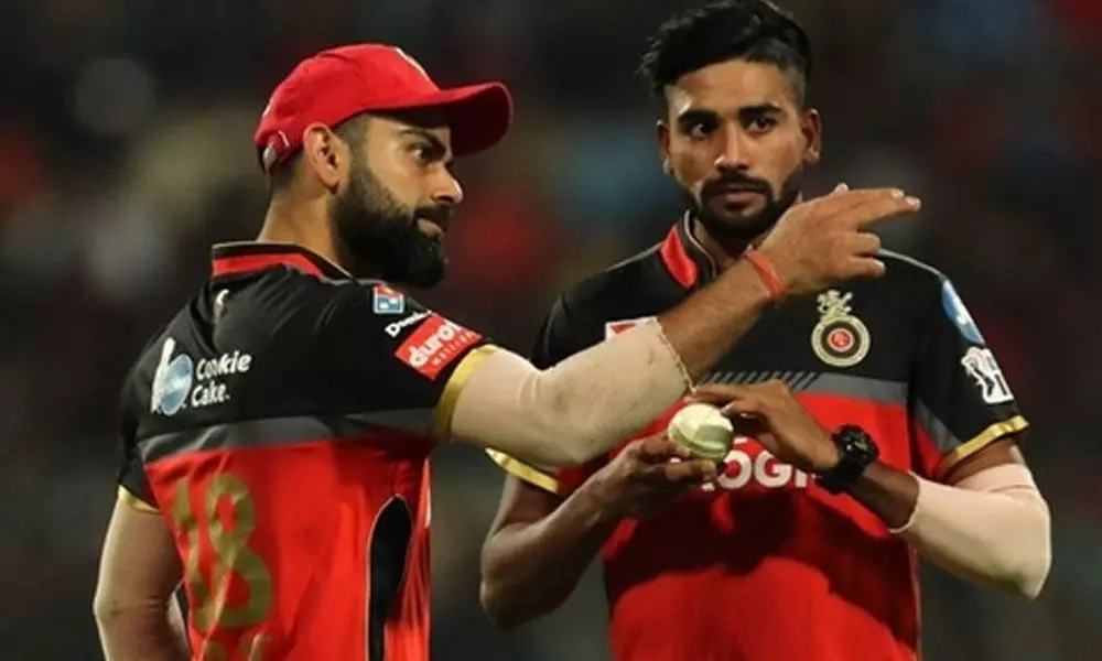 Virat Kohli with Mohammed Siraj