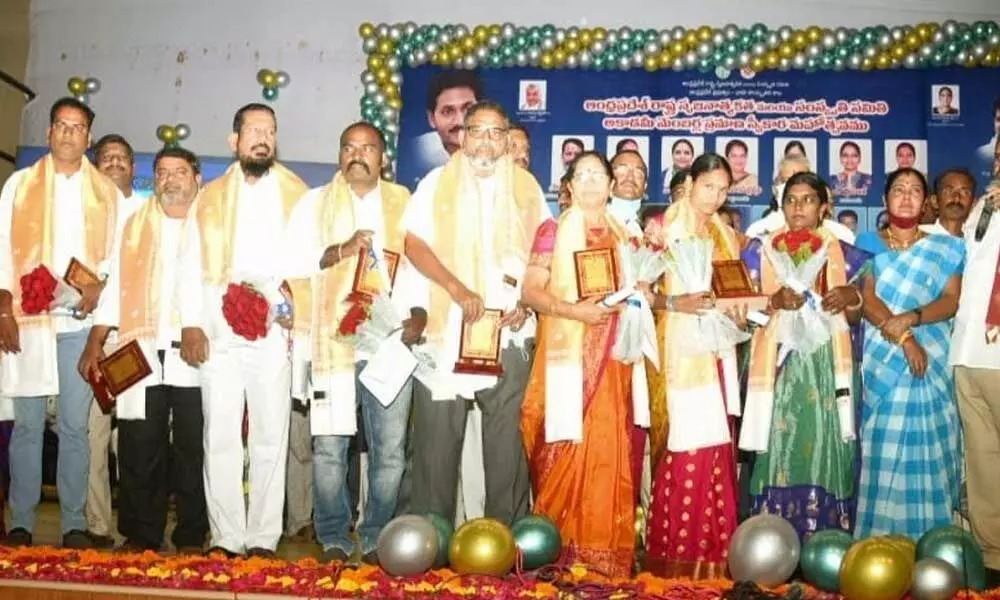 Tourism, Culture, Youth Services Minister Muttamsetti Srinivas along with the new directors and members of seven academies at the swearing-in ceremony in Vijayawada on Tuesday
