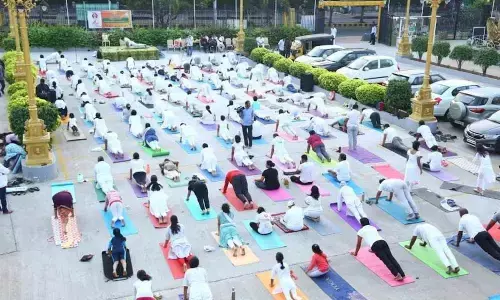 Participants performing suryanamaskarams in Visakhapatnam on Tuesday