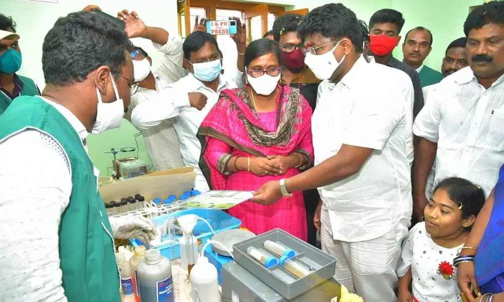 Education Minister A Suresh inspecting the equipment after inaugurating Rythu Bharosa Kendra at Rajupalem of Tripurantakam mandal on Wednesday