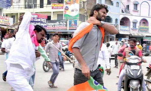 TRS cadres chasing the BJP workers at Jangaon on Wednesday